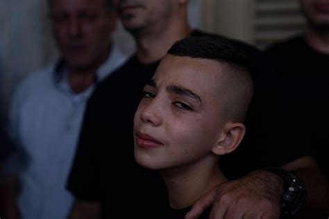 Army fire kills a 14-year-old, Palestinians say, as an Israeli minister visits flashpoint holy site
